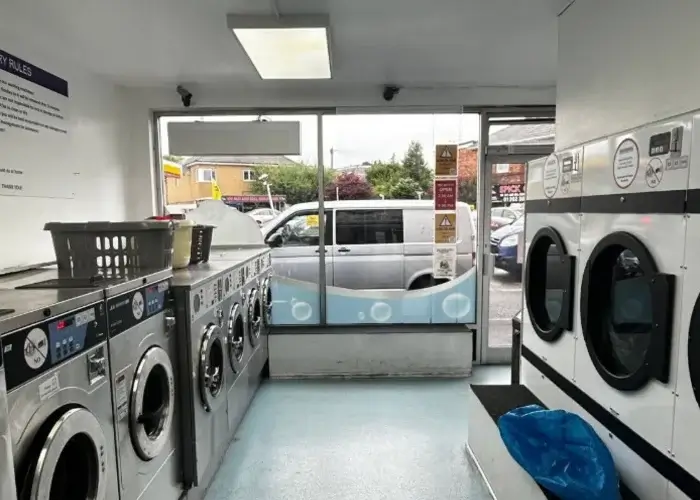 Self-service washing machines at Complete Clothes Care launderette